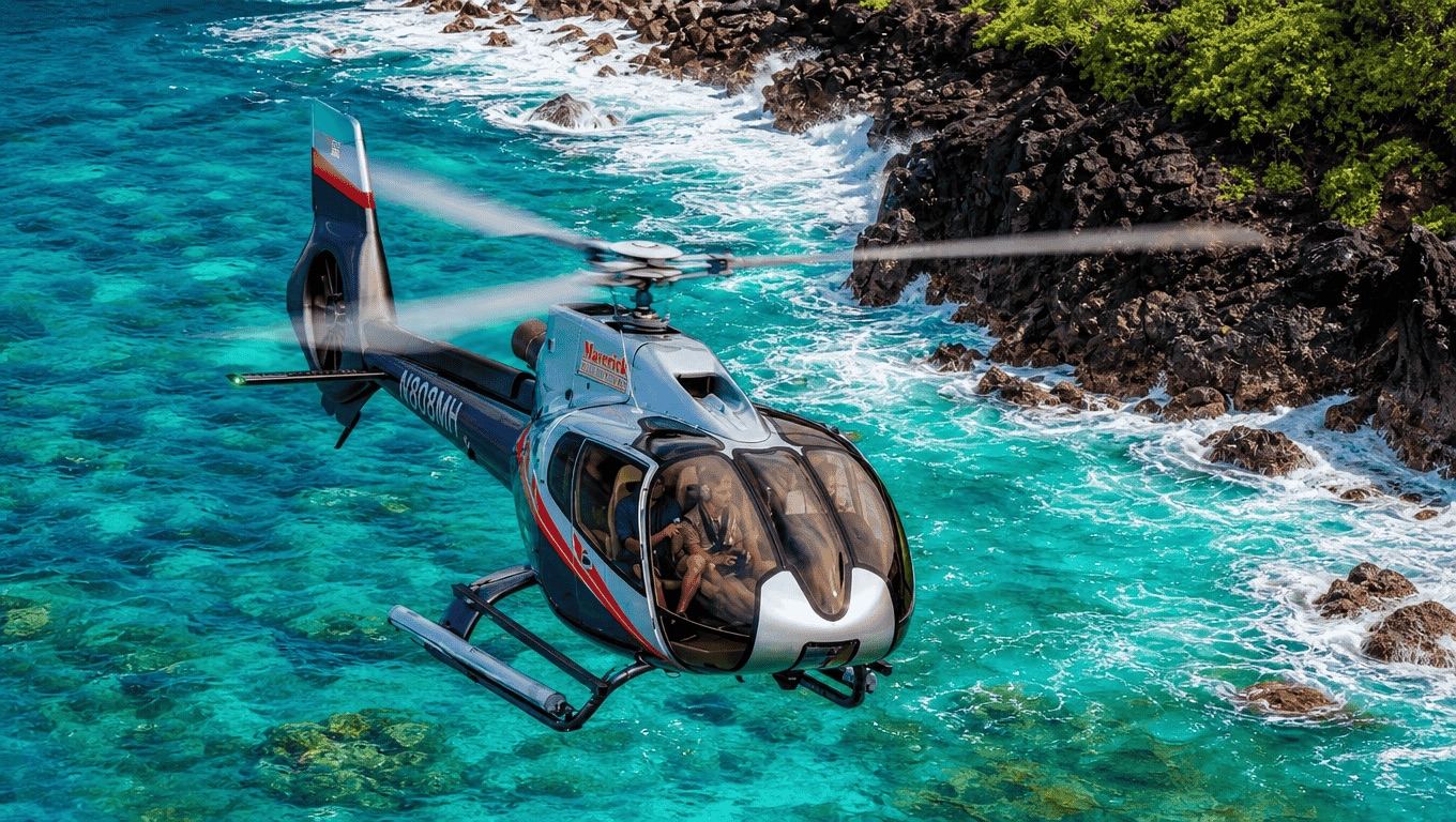 Maverick Helicopters Airbus H130 flying over the Pacific along Maui’s coast