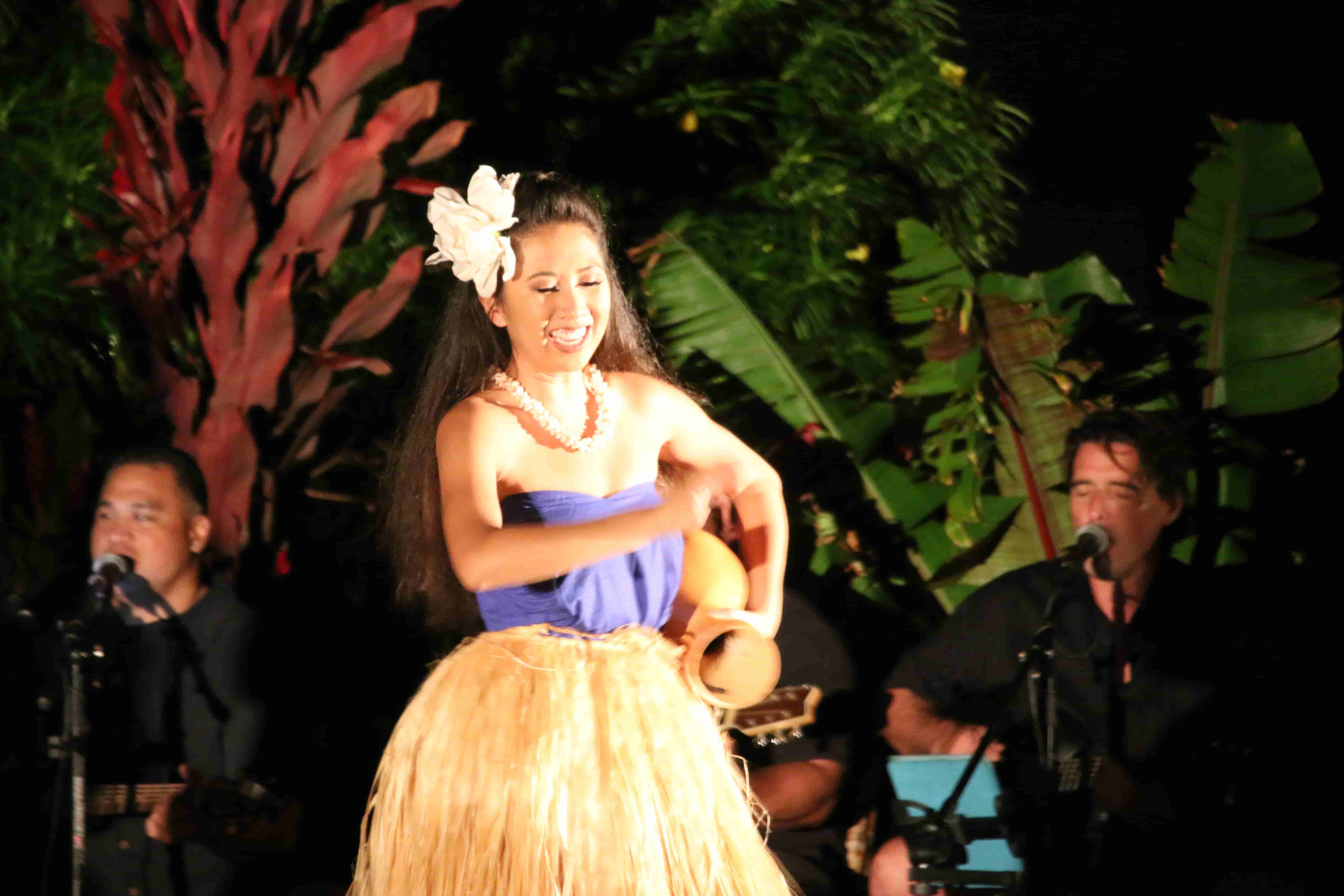 Hula dancer performing with live Hawaiian band